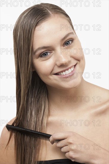 Portrait of smiling woman with wet hair. 
Photo : Jan Scherders