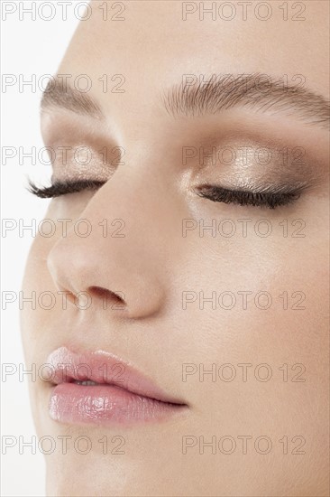 Close-up of female face with subtle make-up. 
Photo : Jan Scherders