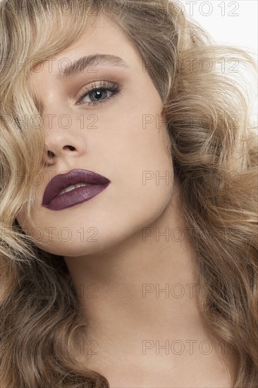 Portrait of beautiful girl with blonde curls. 
Photo: Jan Scherders