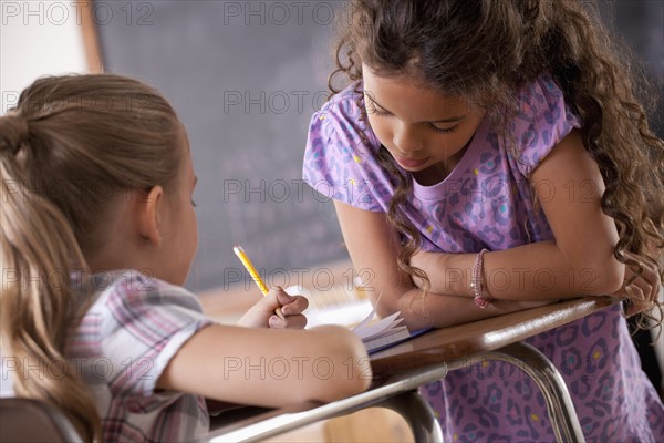 Schoolgirls in classroom. 
Photo : Rob Lewine