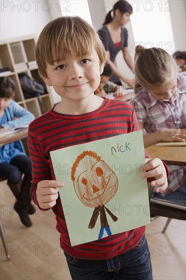 Boy (6-7) showing his drawing. 
Photo: Rob Lewine