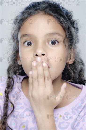 Portrait of girl (6-7), studio shot. 
Photo : Rob Lewine