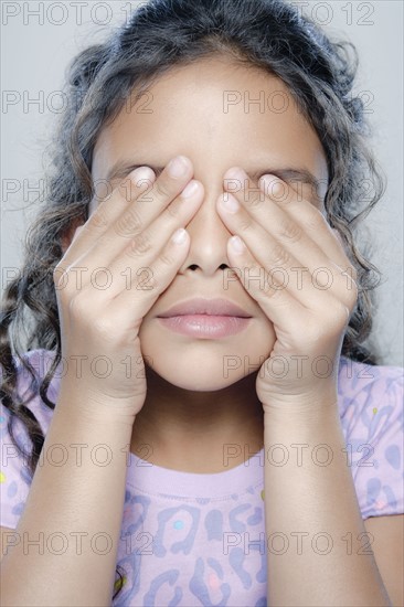 Portrait of girl (6-7), studio shot. 
Photo : Rob Lewine