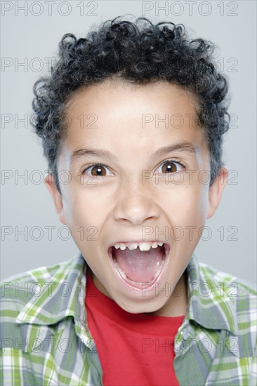 Portrait of boy (8-9), studio shot. 
Photo : Rob Lewine
