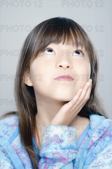 Portrait of girl (8-9), studio shot. 
Photo : Rob Lewine