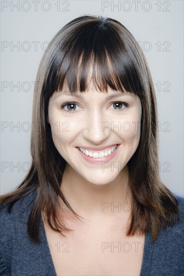 Portrait of young woman, studio shot. 
Photo : Rob Lewine