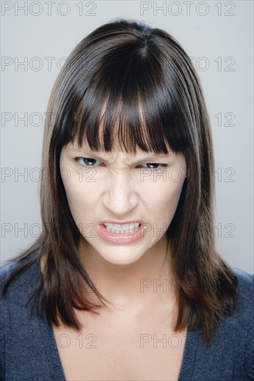 Portrait of young woman, studio shot. 
Photo : Rob Lewine