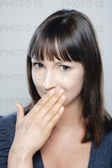 Portrait of young woman, studio shot. 
Photo : Rob Lewine