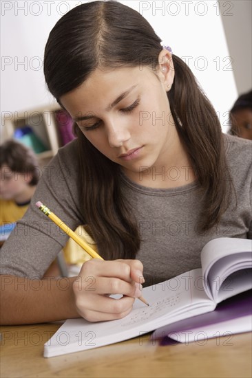Schoolgirl (12-13) at school.
Photo : Rob Lewine