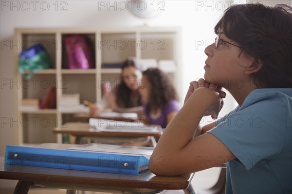 Portrait of schoolboy (10-11) contemplating. 
Photo: Rob Lewine