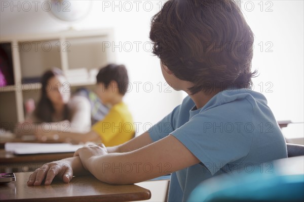Portrait of schoolboy (10-11) contemplating.
Photo : Rob Lewine