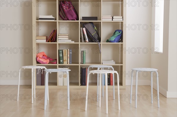 Empty classroom with stools. 
Photo : Rob Lewine