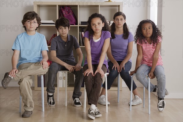 Portrait of serious pupils sitting in classroom. 
Photo: Rob Lewine