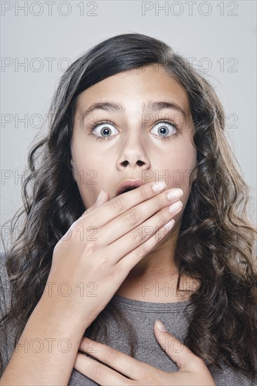 Portrait of girl (12-13) expressing fear. 
Photo : Rob Lewine