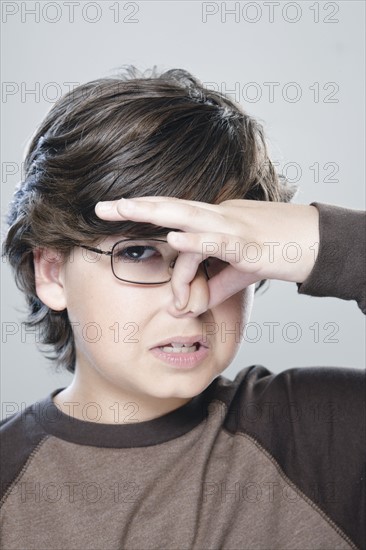 Portrait of boy (10-11), studio shot. 
Photo : Rob Lewine