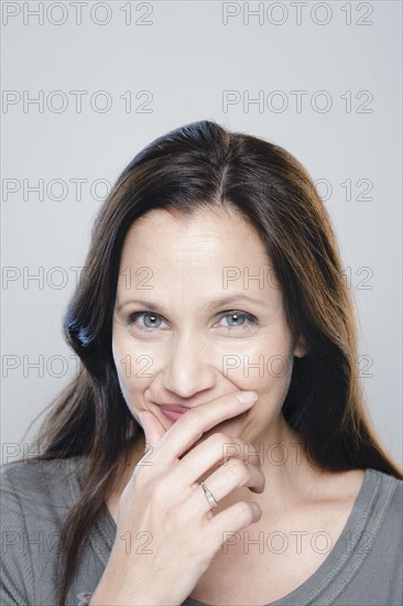 Portrait of mature woman, studio shot. 
Photo: Rob Lewine