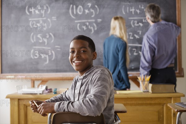 Portrait of teenage boy (14-15) at school. 
Photo : Rob Lewine