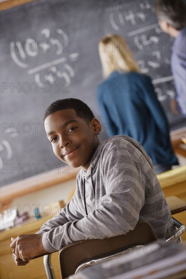 Portrait of teenage boy (14-15) at school. 
Photo: Rob Lewine