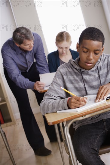 Teacher with teenage students (14-15) at school. 
Photo : Rob Lewine