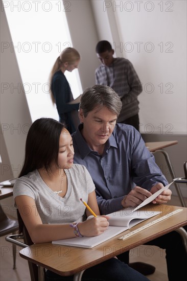 Teacher with teenage students (14-15) at school. 
Photo: Rob Lewine