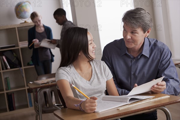 Teacher with teenage students (14-15) at school. 
Photo : Rob Lewine