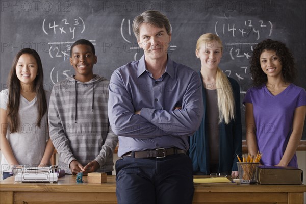 Teacher with teenage students (14-15,16-17) at school. 
Photo : Rob Lewine