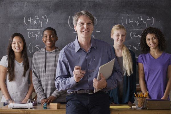 Teacher with teenage students (14-15,16-17) at school. 
Photo : Rob Lewine