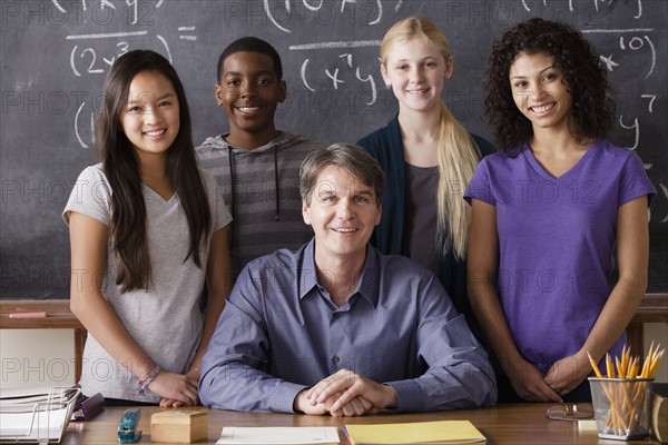 Teacher with teenage students (14-15,16-17) at school. 
Photo : Rob Lewine