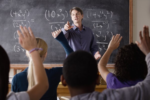 Teacher with teenage students (14-15,16-17) at school. 
Photo: Rob Lewine