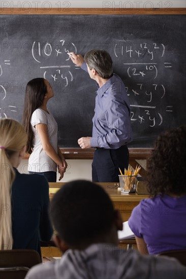 Teacher with teenage students (14-15,16-17) at school. 
Photo : Rob Lewine