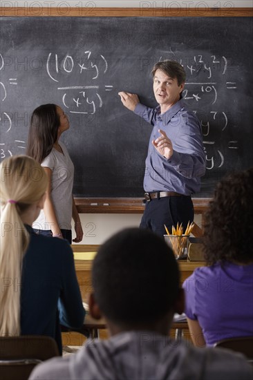 Teacher with teenage students (14-15,16-17) at school. 
Photo : Rob Lewine