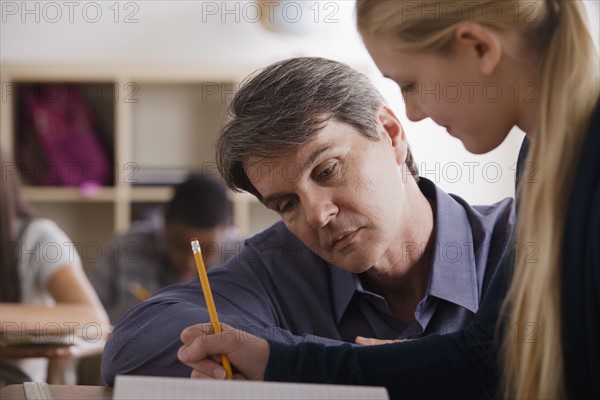 Teacher with teenage students (14-15) at school. 
Photo : Rob Lewine