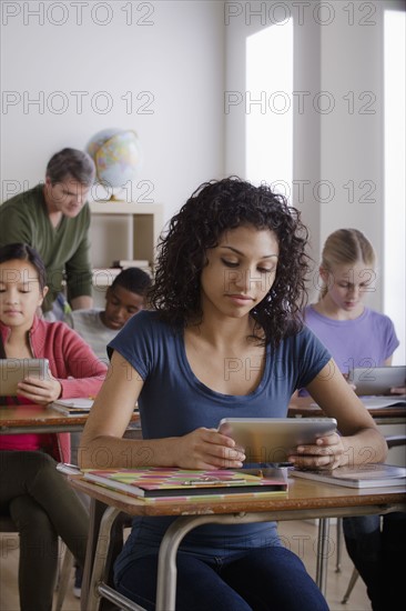 Teacher and teenage students (14-15, 16-17). 
Photo: Rob Lewine