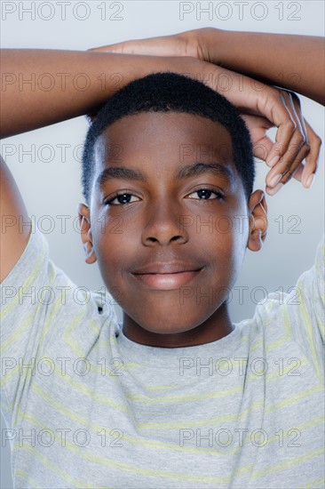 Portrait of teenage boy (14-15), studio shot. 
Photo : Rob Lewine