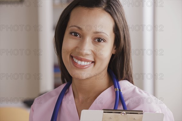 Portrait of young female doctor. 
Photo : Rob Lewine