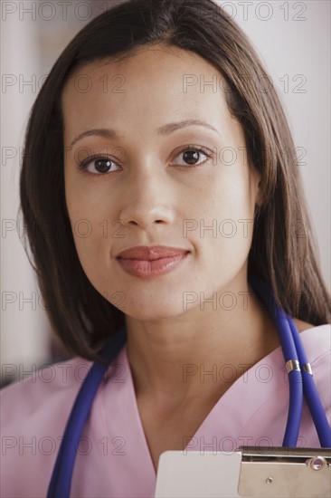 Portrait of young female doctor. 
Photo : Rob Lewine