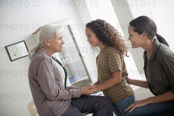 Girl (8-9) with mother at doctor's office. 
Photo: Rob Lewine