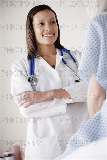 Young doctor talking with senior patient. 
Photo : Rob Lewine