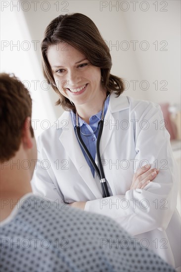Smiling doctor talking with patient. 
Photo: Rob Lewine