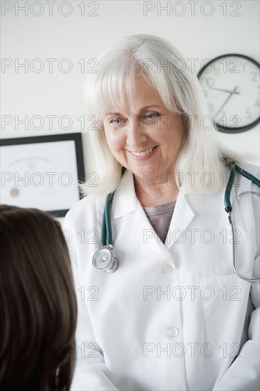Senior doctor talking with patient. 
Photo: Rob Lewine