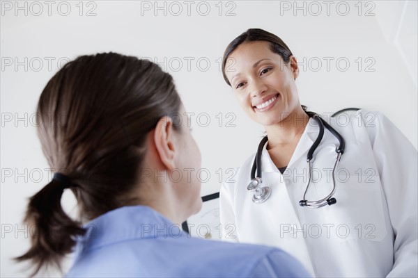 Doctor talking with patient. 
Photo : Rob Lewine