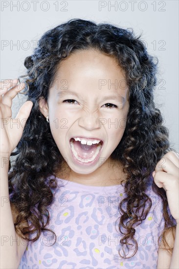 Girl (8-9) screaming, studio shot. 
Photo : Rob Lewine