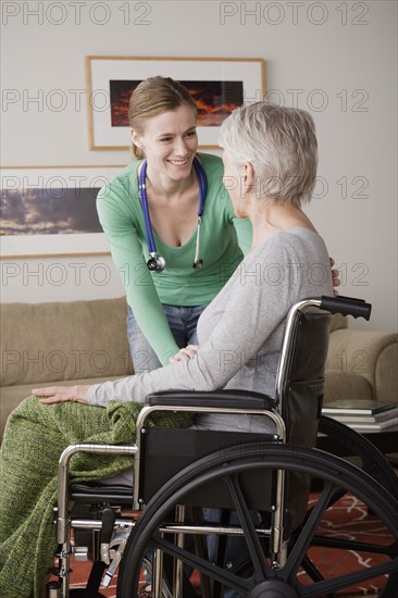 Young female nurse taking care of senior woman. 
Photo : Rob Lewine