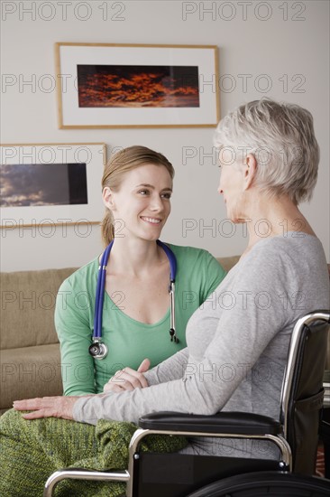 Young female nurse taking care of senior woman. 
Photo : Rob Lewine