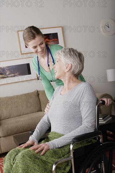 Young female nurse taking care of senior woman. 
Photo : Rob Lewine