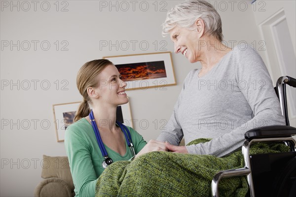 Young female nurse taking care of senior woman. 
Photo : Rob Lewine