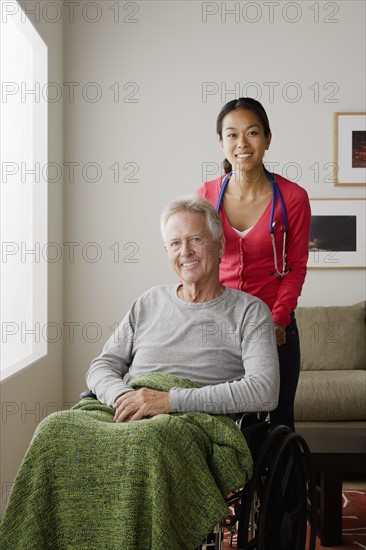 Portrait of young female nurse and senior man. 
Photo : Rob Lewine