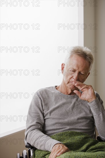 Portrait of senior man on wheelchair. 
Photo : Rob Lewine