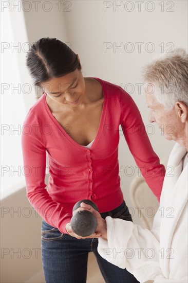 Female nurse with senior patient at home. 
Photo: Rob Lewine