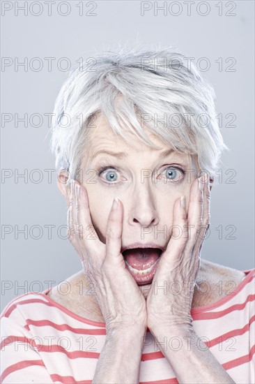 Portrait of shocked senior woman, studio shot. 
Photo: Rob Lewine